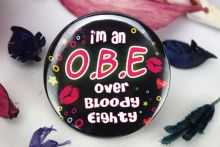 O.B.E - 80th Party Badge